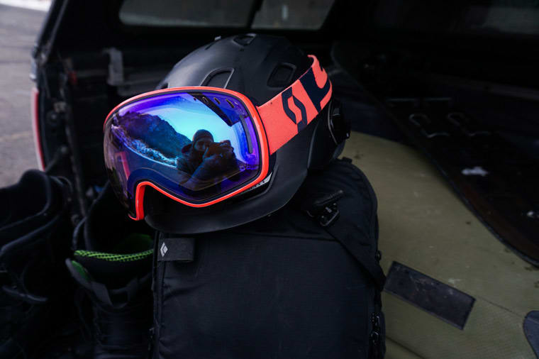 Ski goggles pulled up onto a ski helmet