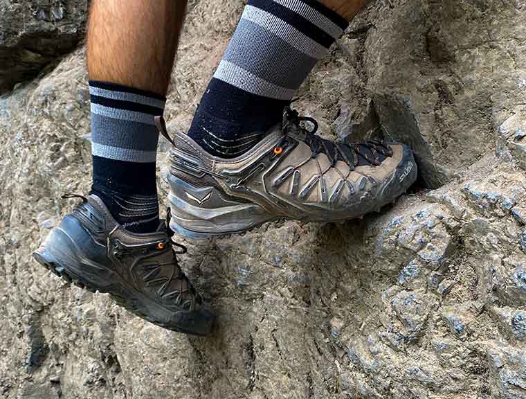 The Salewa Wildfire GTX shoe being worn while climbing a slab