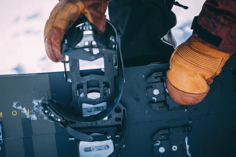 Close up of putting bindings on a splitboard