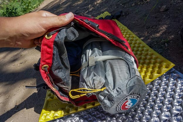 Fly Creek HV UL2 tent in stuff sack being packed into a backpack