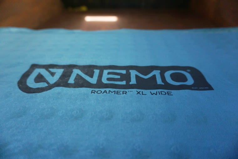 Nemo logo on the Roamer sleeping pad in the extra long wide size option in the bed of a truck.