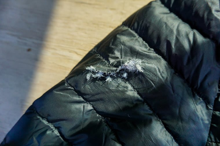 Hole in puffer on sale jacket