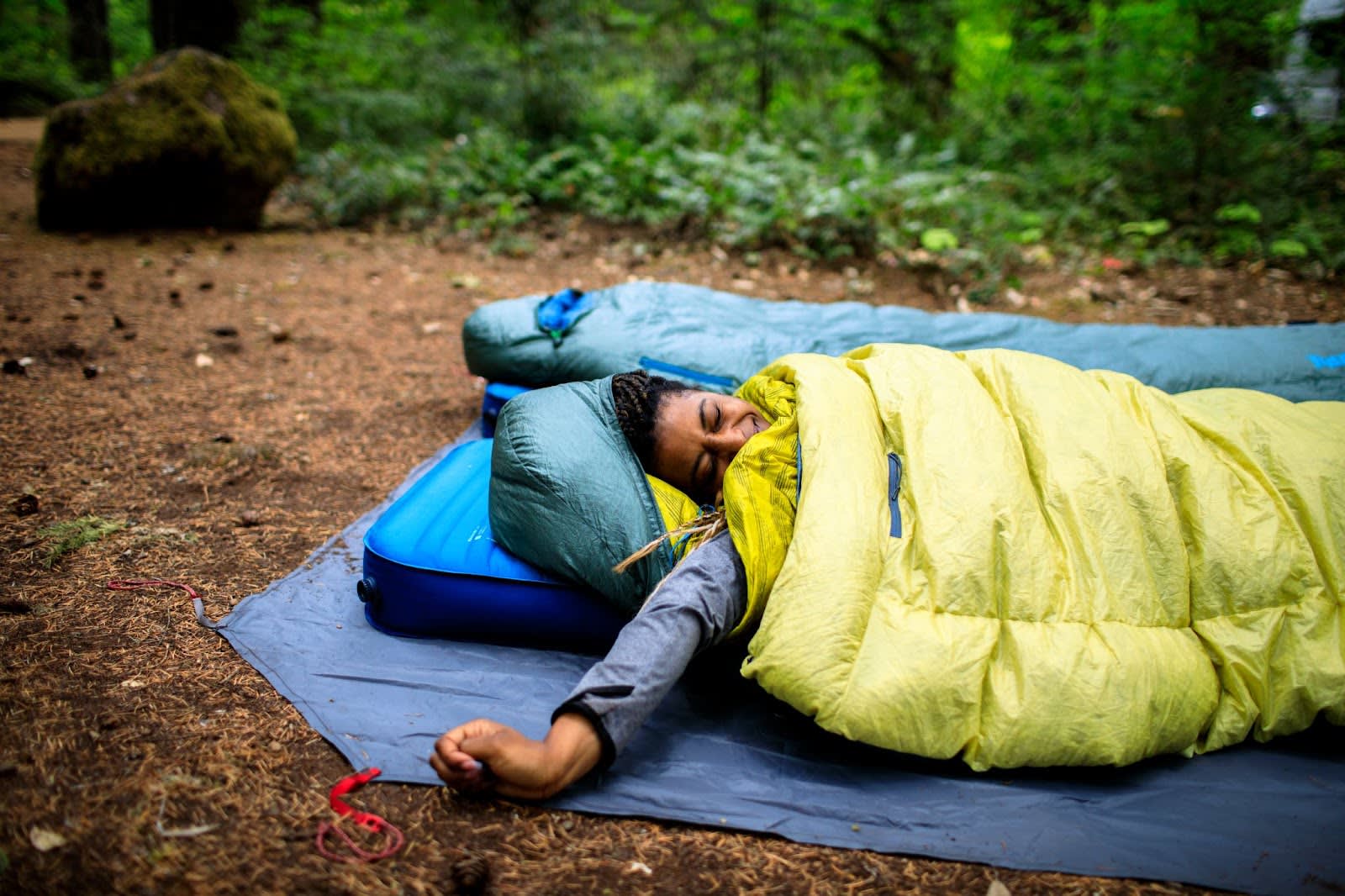 Woman stretching while waking up on the Mondoking