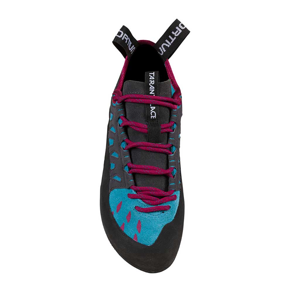 Beginner climber in gym wearing La Sportiva Tarantulace