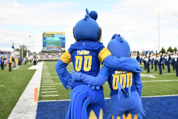 Blue hen mascots hugging on field