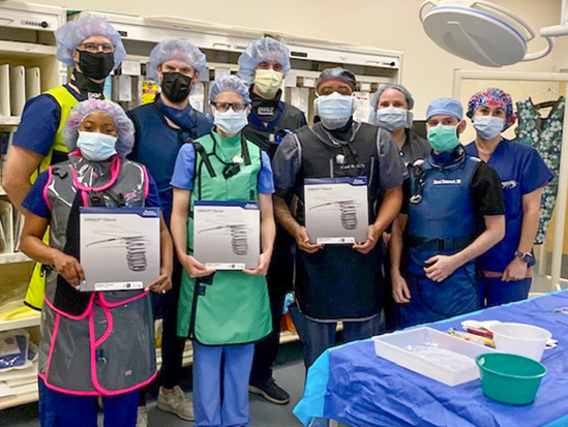 Physicians posing with EMBOLD Fibered Detachable Coil System 