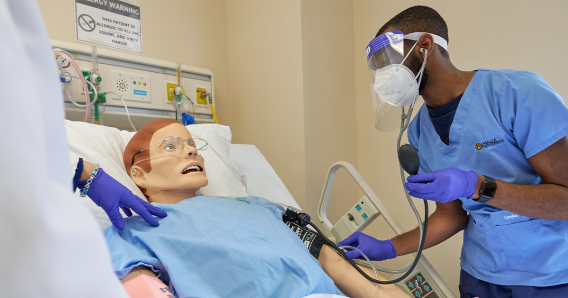 nursing student practicing on dummy