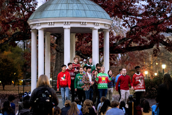 The student a cappella group, UNC Clef Hangers, perform at The Old Well at dusk on the last day of classes (LDOC) for the fall semester on the campus of the University of North Carolina at Chapel Hill, December 1, 2021.