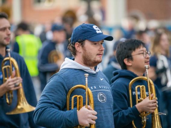 The Alumni Blue Band performs in the 2022 Homecoming Parade.  Credit: Penn State Alumni Association / Penn State. All Rights Reserved.