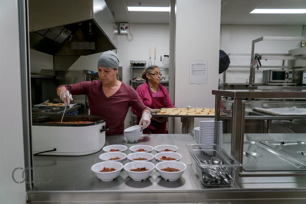 Woman serves school meals