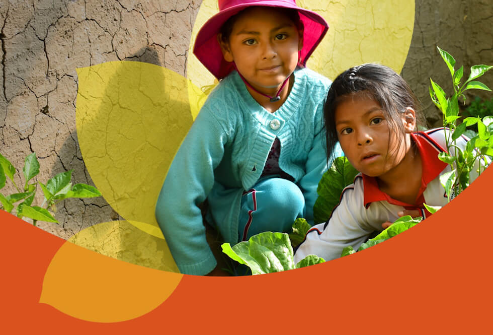 Two Bolivian girls working in their family garden