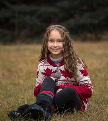 Grayce sitting outside