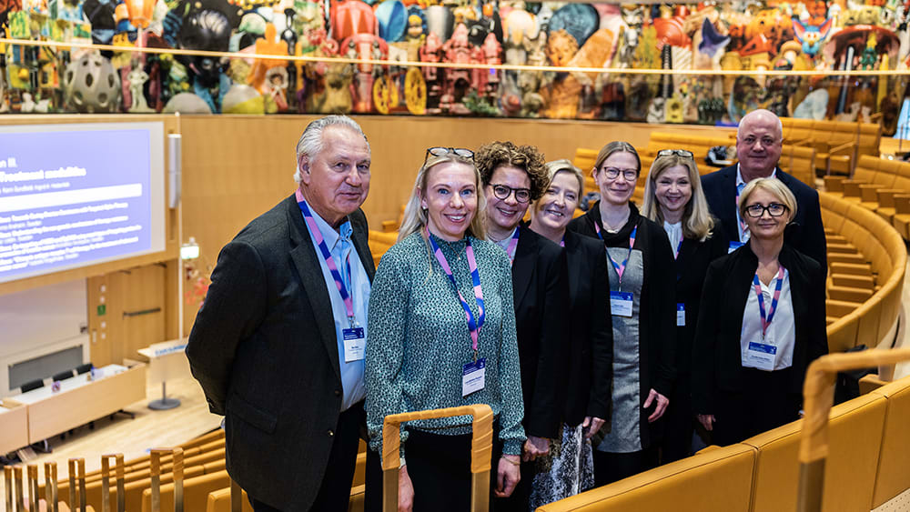 Researchers in an auditorium