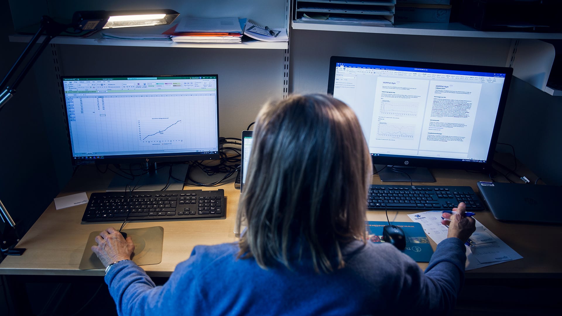 Head in front of two computers