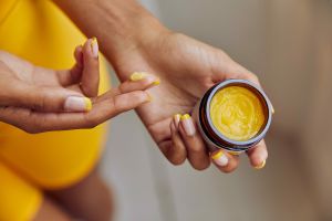 Applying Cannaray CBD muscle balm