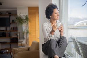 Woman looking out of window