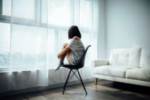 Woman staring out window