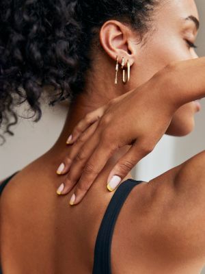 Woman Massaging Neck with CBD Muscle Balm