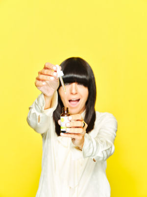 Claudia Winkleman holding Cannaray CBD Oil