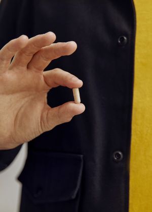 Holding CBD Capsule in Hand
