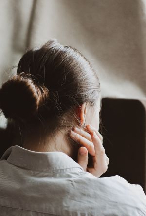 Woman massaging neck