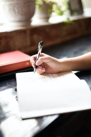 Woman writing in journal