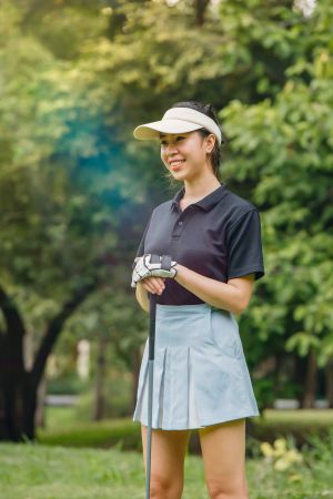 Female golfer holding club