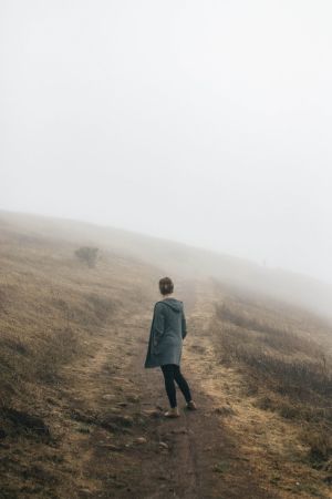 Woman standing in fog