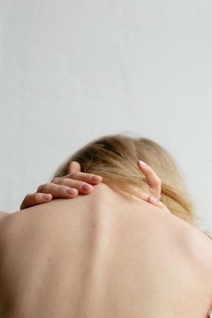 Woman Massaging Spine