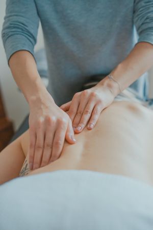 woman massaging back