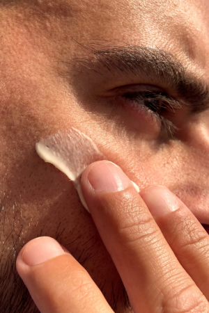 Man applying Cannaray CBD Skin Cream