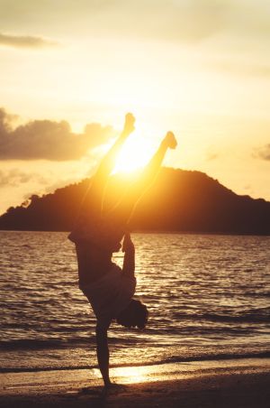 Man standing on one arm