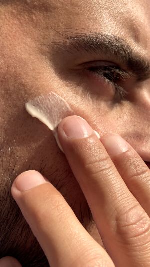 Man applying Cannaray CBD Skin Cream