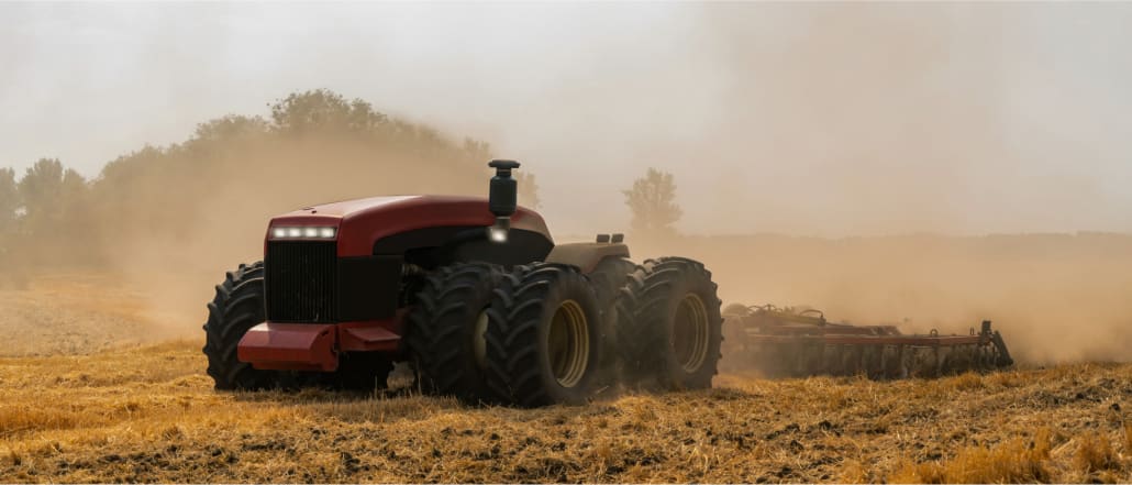 Uncrewed tractor plows a field