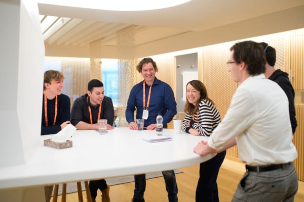 Canonical team members collaborating around a table