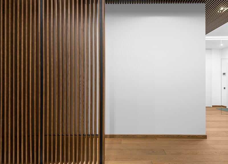 Timber slat corridor with illuminated wall mockup