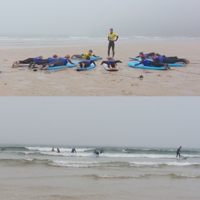 Surfari event delegates on the beach learning how to surf