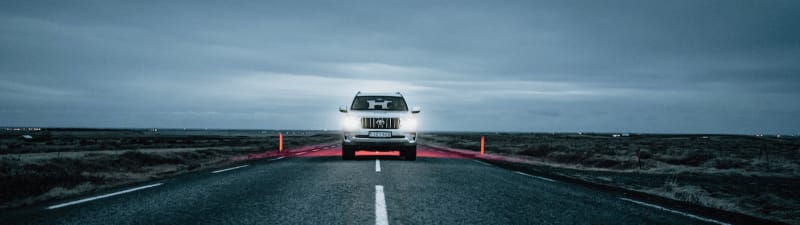 Car stopped in the middle of the road in Iceland, forbidden