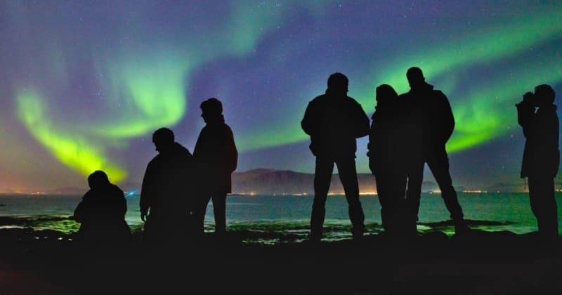 Image of people enjoying the Northern Lights in Iceland