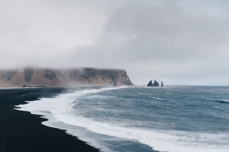 Image of the black sand beach and the ocean in Iceland