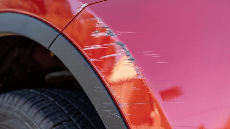 Image of a red scratched vehicle
