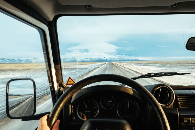 Image of a person driving in Iceland