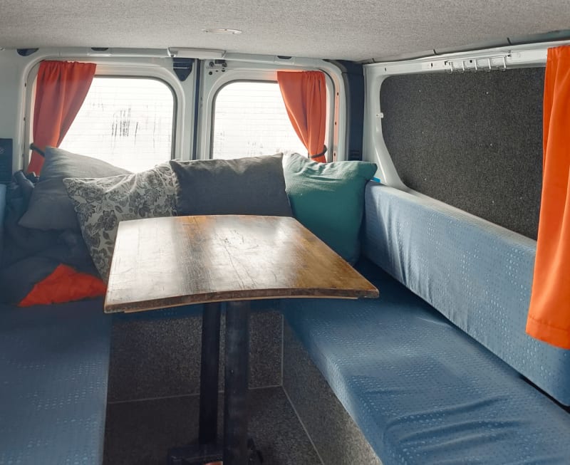 Image of the inside of a motorhome rental in Iceland, sleeping quarters and more.