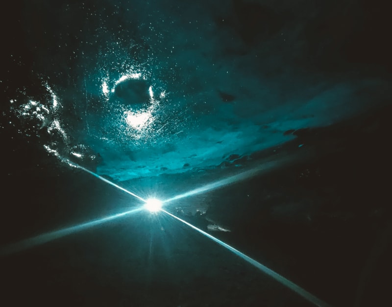 Image of a bright blue light inside the Glacier Lagoon Cave