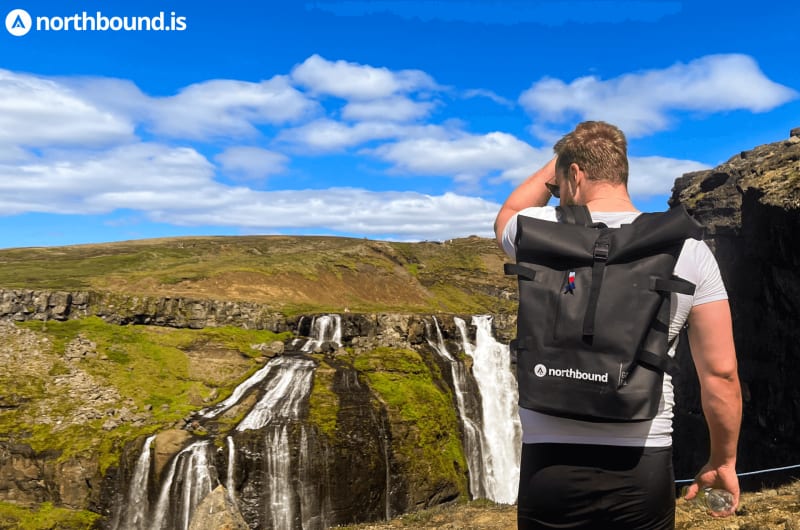 Man standing in front of Glymur Iceland, nature, waterfall