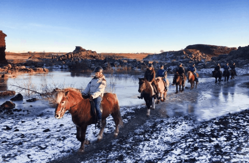 Image of people riding horses in Iceland