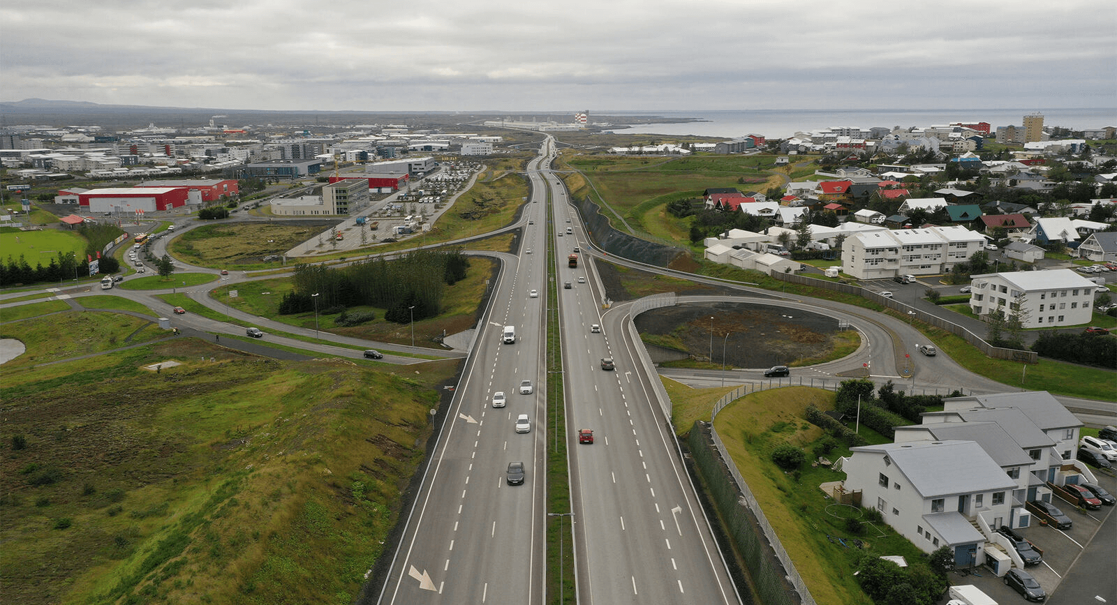 Image of a highway in Reykjavik, Iceland with cars driving.