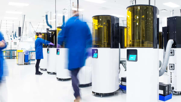 Several people working in a Carbon printer lab