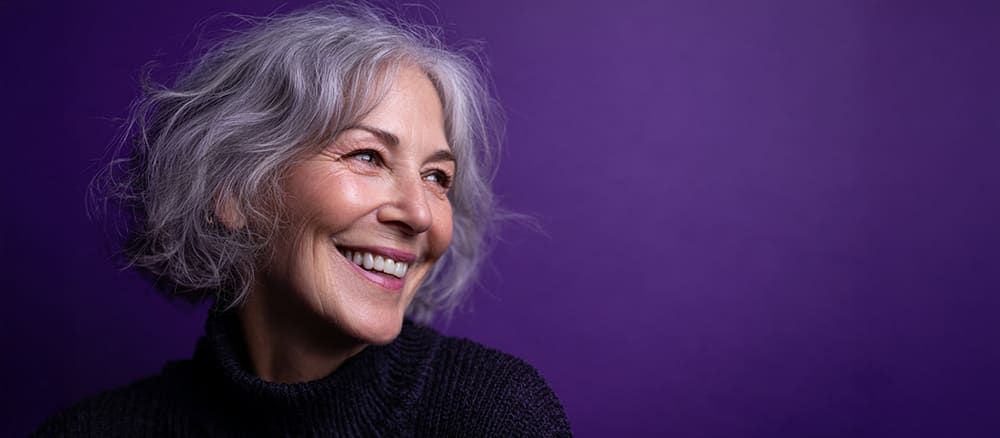 Woman looking right on a purple background