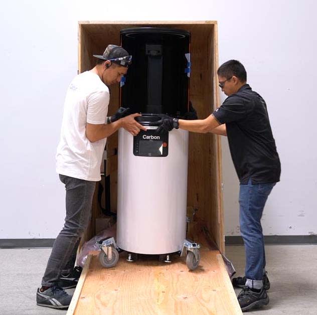 Unloading a Carbon printer from a shipping crate